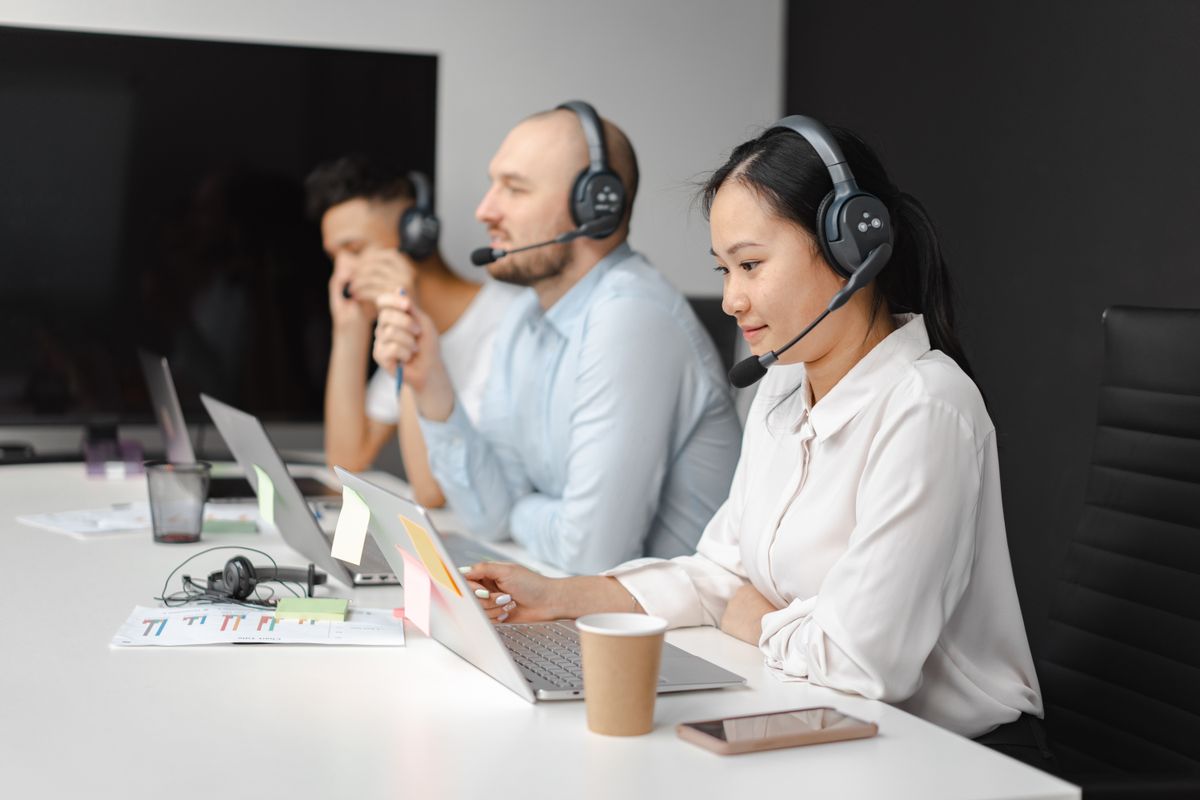 Customer service agents at work with headsets